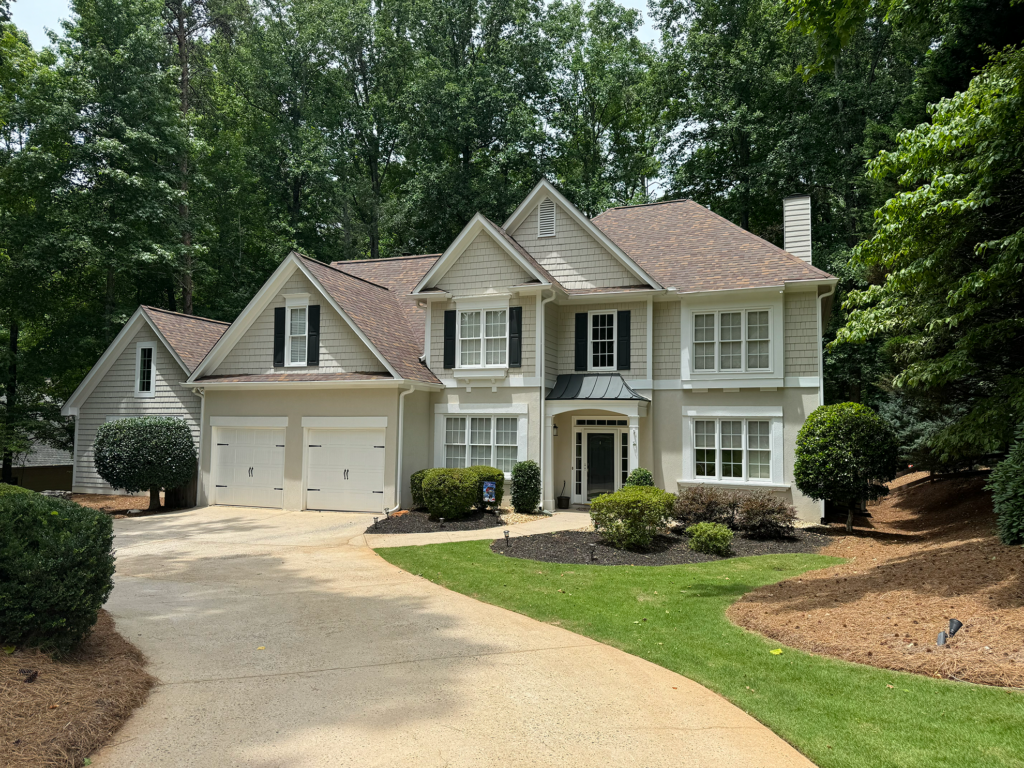 Beautiful residential home protected by quality roofing from Invictus Roofing, a trusted roofing company for roof repair and roof replacement