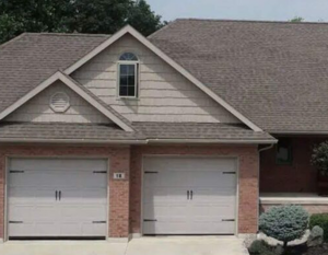 Before residential roof replacement project by Invictus Roofing showing a home with an asphalt shingle roof before roofing services